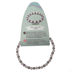 Pulsera yin yang cuarzo rosa y cuarzo ahumado en su blister explicativo sobre fondo blanco en El Bazar de Monty