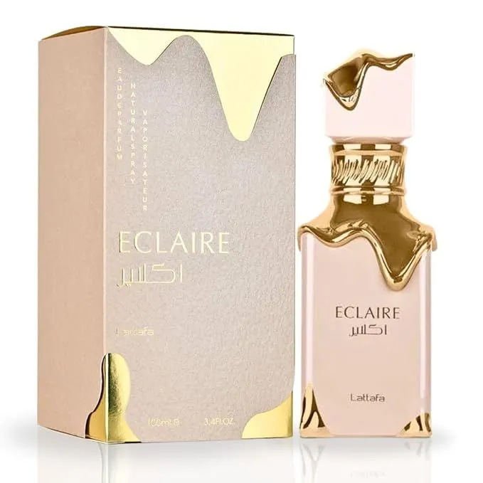 Perfume Árabe Eclaire Lattafa Original 👑 Fotografia real del perfume arabe eclaire de cien mililitros de la marca lattafa mostrando su frasco marron con detalles metalicos dorados en relieve junto a su caja de lujo