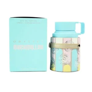 Fotografia real del perfume arabe odyssey marshmallow de cien mililitros de la marca armaf mostrando su frasco exclusivo de diseño cilindrico junto a su caja elegante