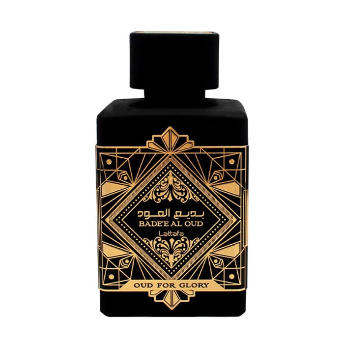 Perfume Arabe Oud for Glory Lattafa Original 👑 Fotografia real del perfume arabe oud for glory de cien mililitros de la marca lattafa mostrando su frasco negro con grabados dorados misticos junto a su caja de lujo abierta